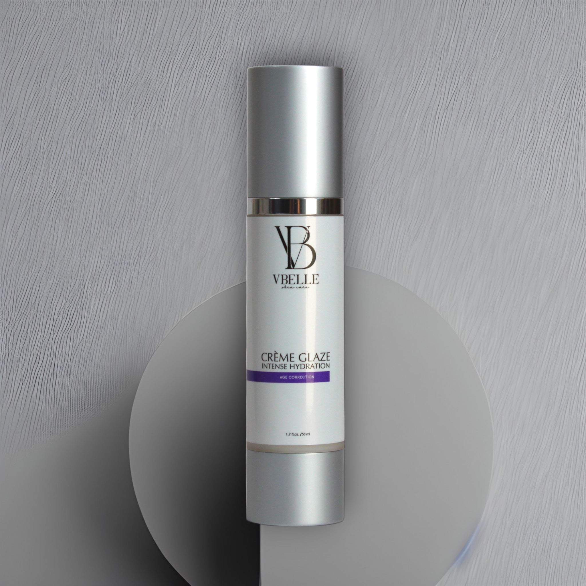 bottle of creme glaze organic tightening face cream with a grey textured Art Deco background
