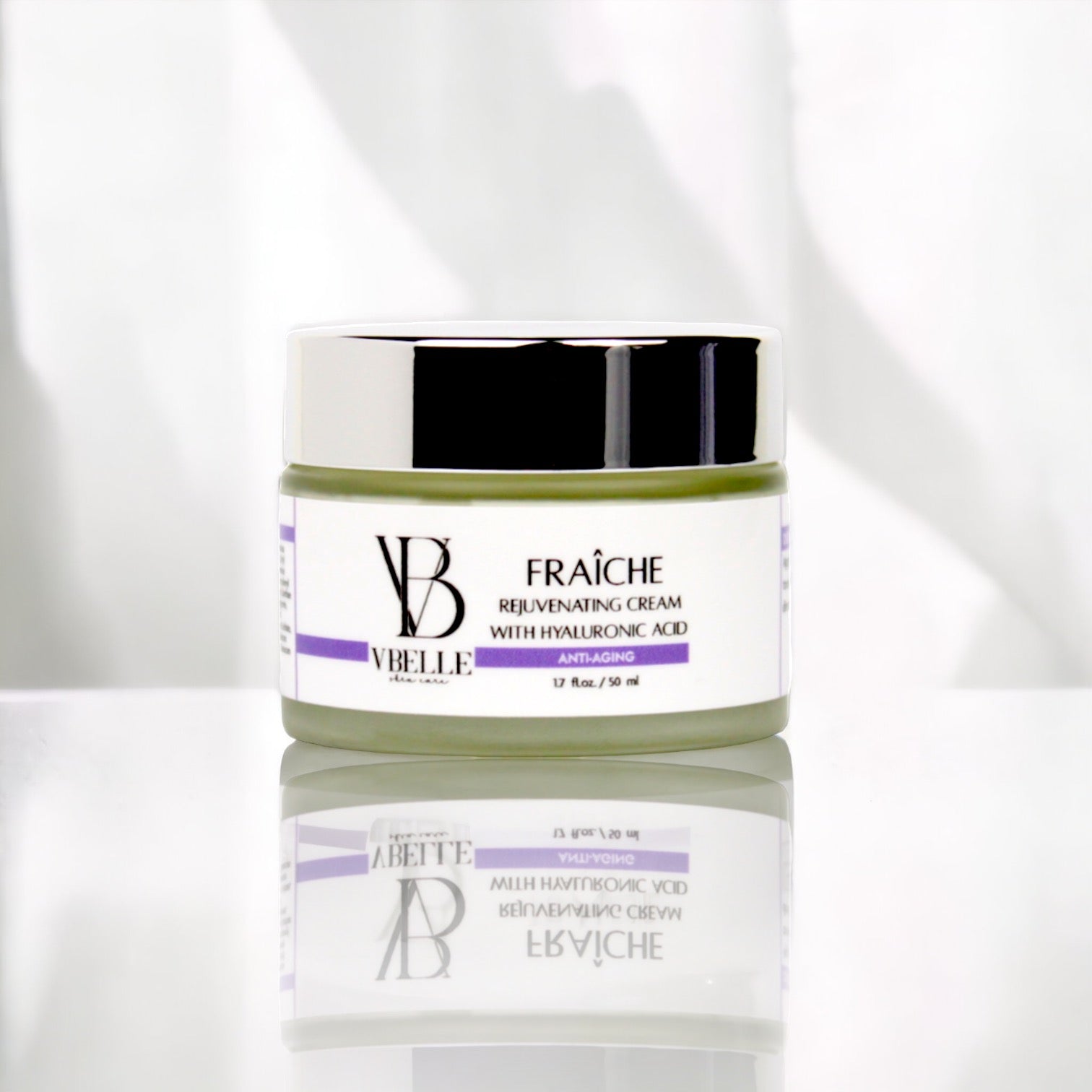a jar of Fraiche rejuvenating Cream on a reflective white counter top