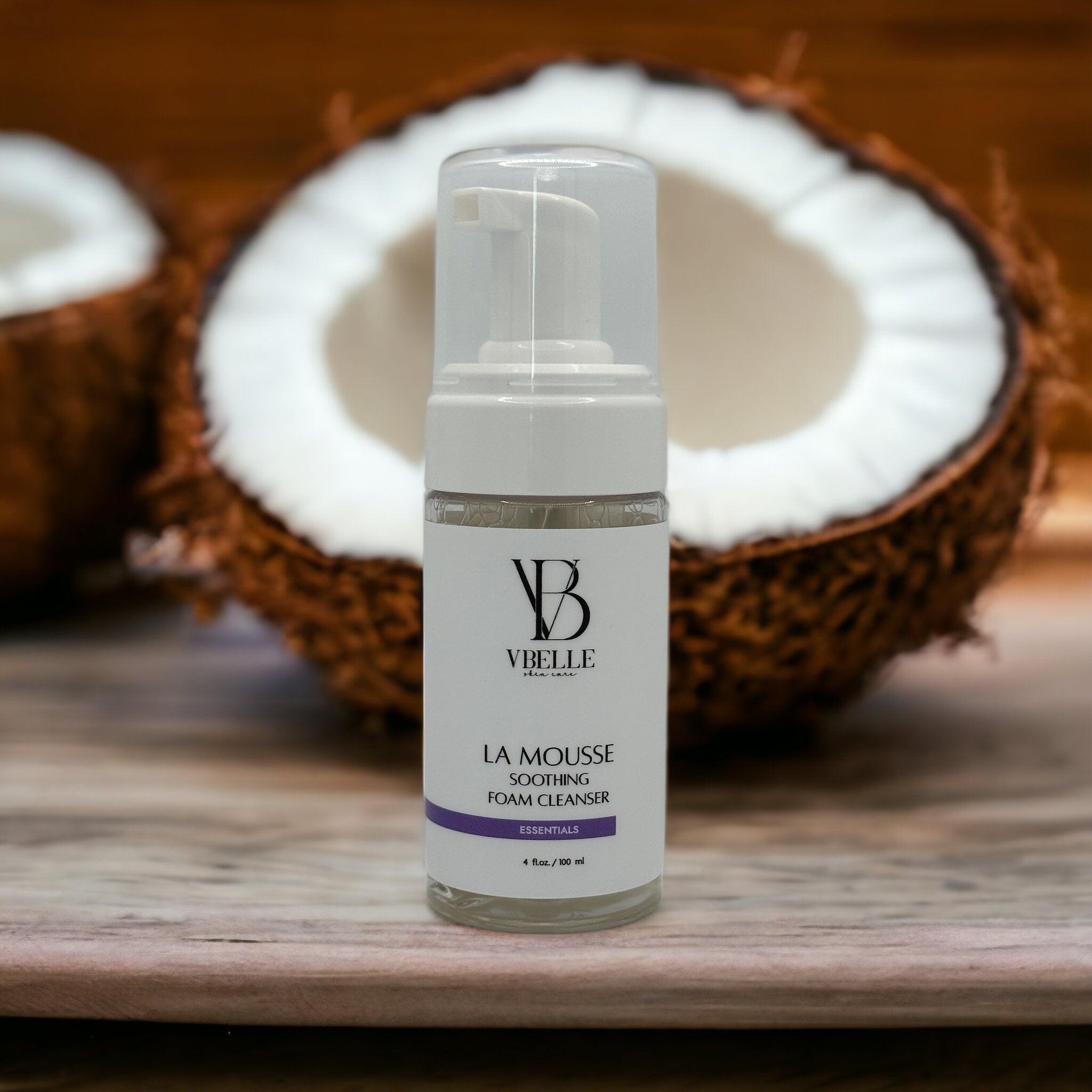 Organic La Mousse Soothing Foam Cleanser 4 fl oz airless pump bottle with a coconut in the background