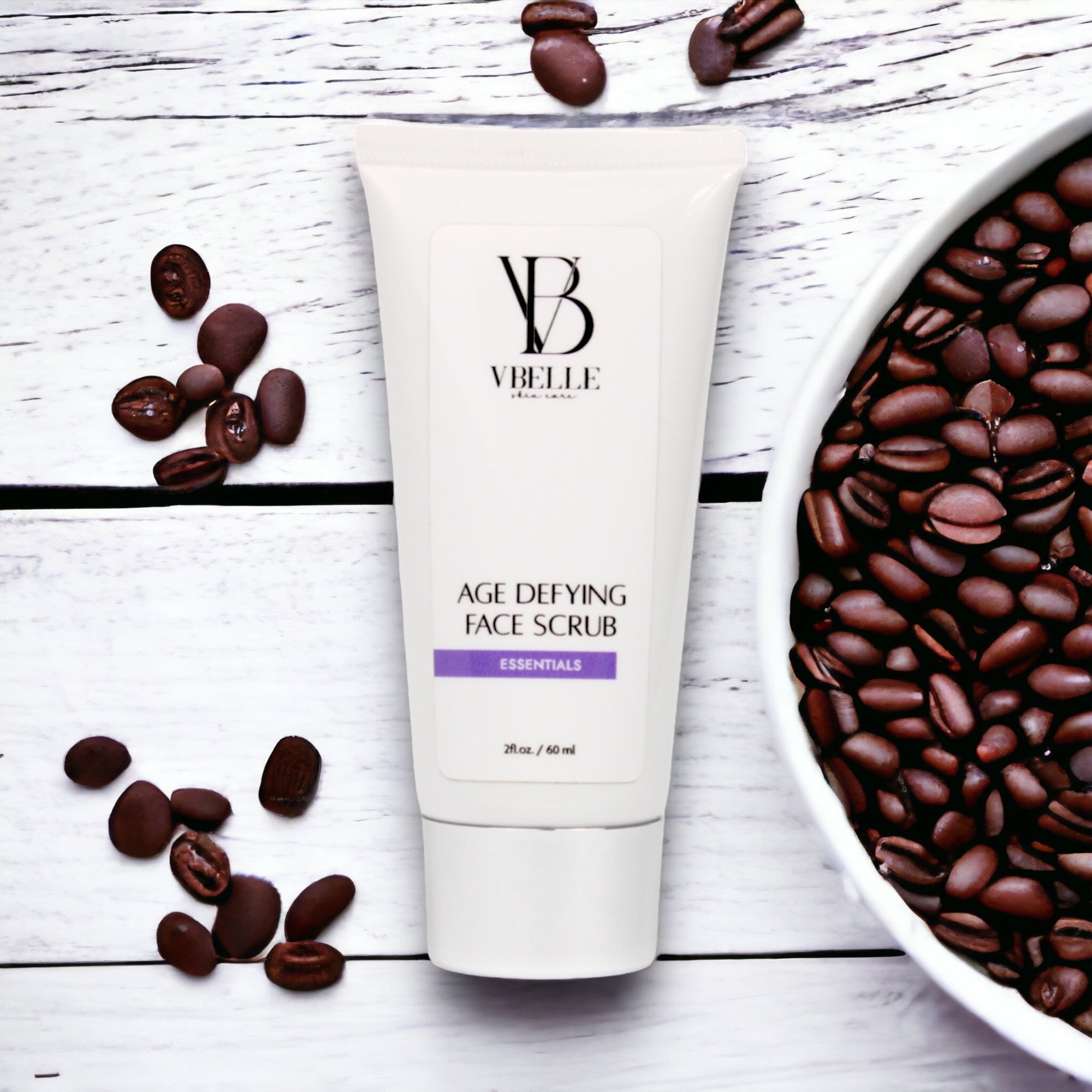 Organic Age Defying Face Scrub tube surrounded by coffee beans