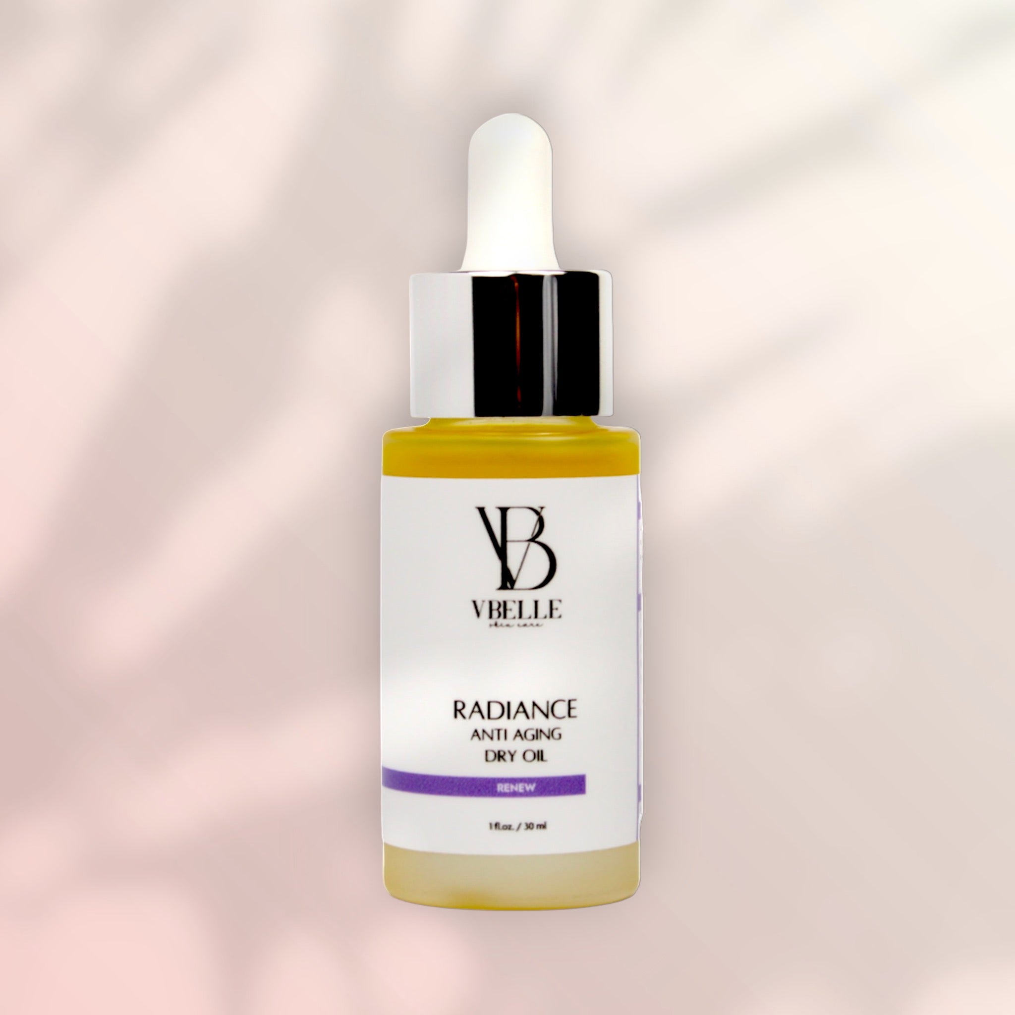 bottle of radiance dry oil with shadow of palm leave