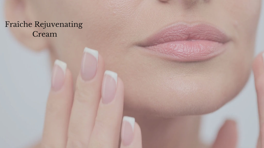 beautiful female model applying organic fraiche rejuvenating face cream with hyaluronic acid video clip